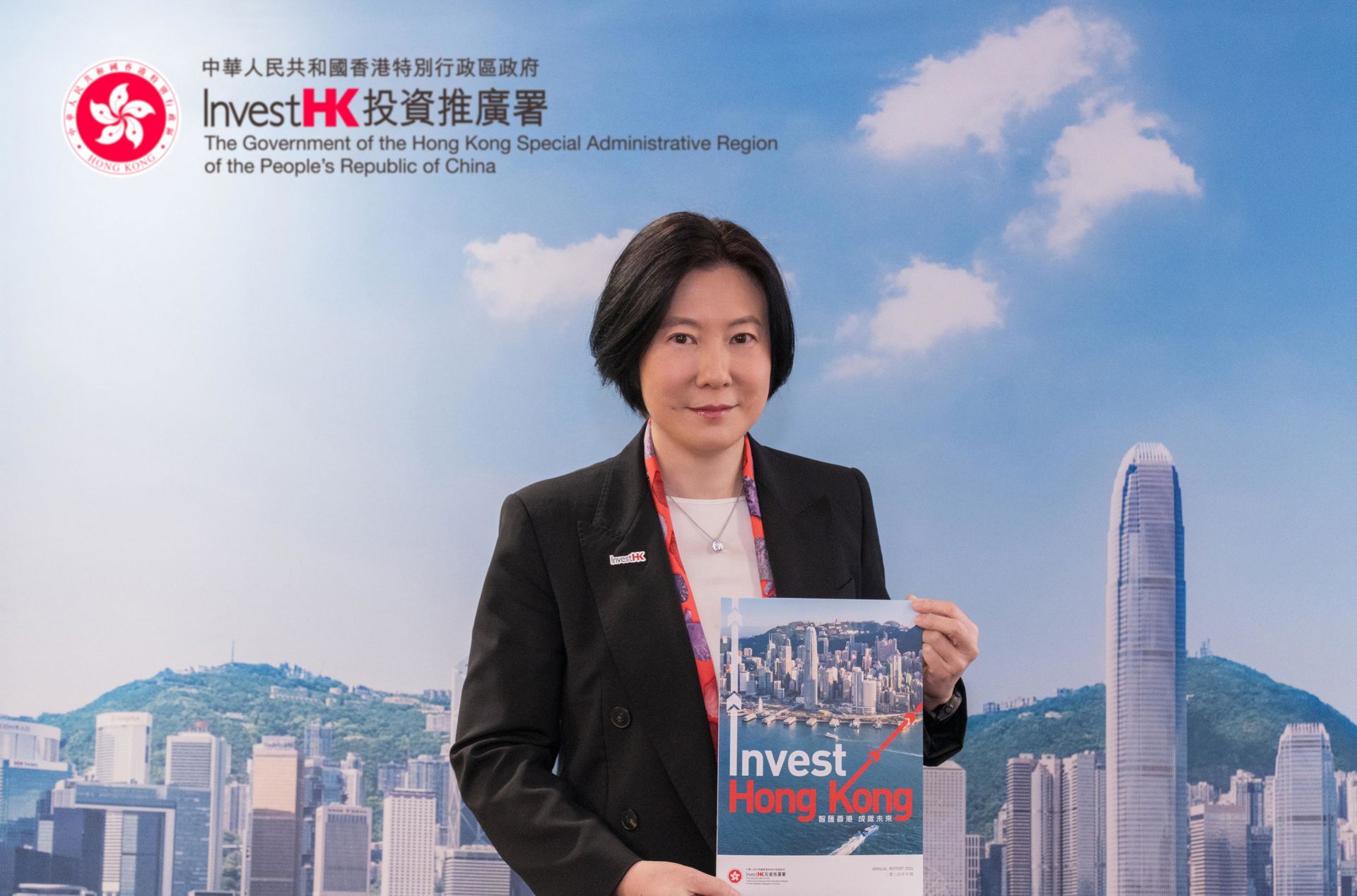 The Director-General of Investment Promotion, Ms Alpha Lau, holding InvestHK’s annual report 2024